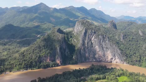 Aerial-View-Of-Towering-Cliffs-Along-Mekong-River-In-Luang-Prabang