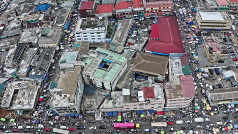 crowd of people and cars at accra central market