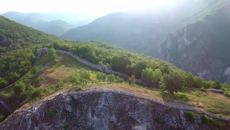 People-Hiking-on-a-Mountain-Outside-of-Novi-Pazar-in-Serbia-Europe-on-a-Sunny-Day,-Aerial-Forward