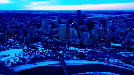 4k twilight edmonton winter city aerial reverse drone flight at the downtown south east centered from the fairmont hotel macdonald overlooking the low level bridge and the north saskatchewan river1-2