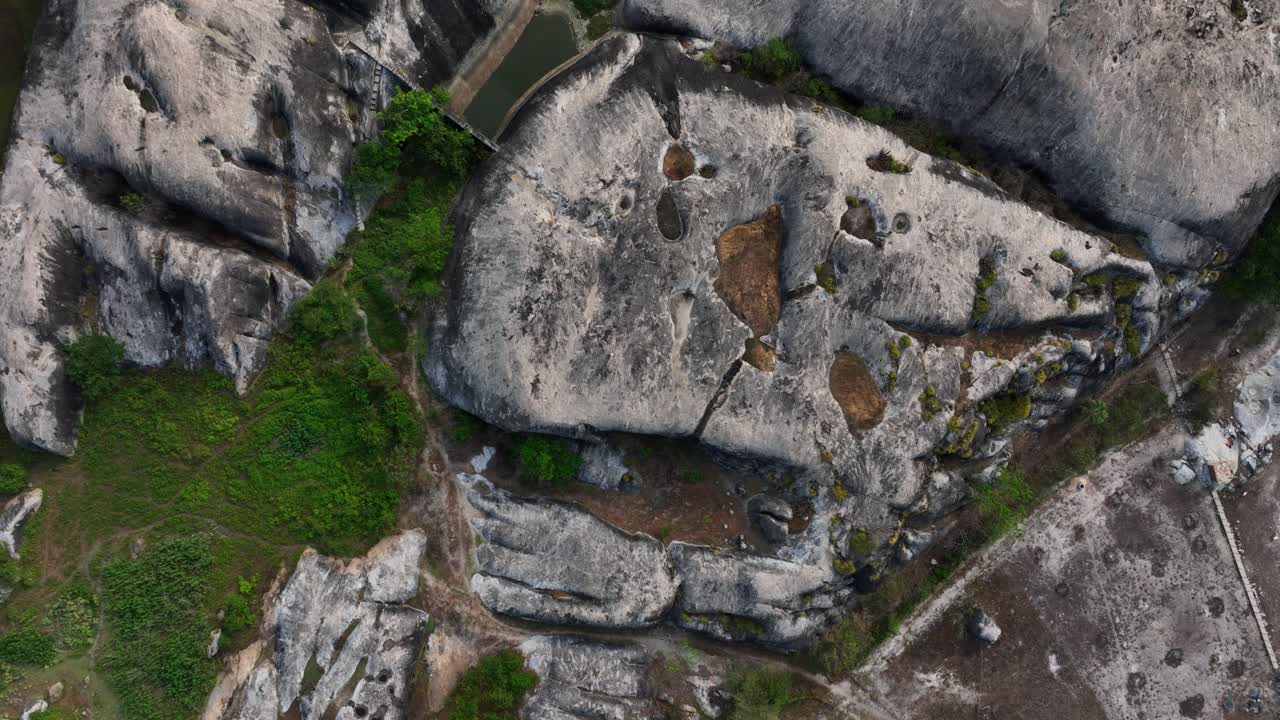 Aerial: big rocks in the nature during the day in Chaval, Ceara, Brazil, top down drone shot