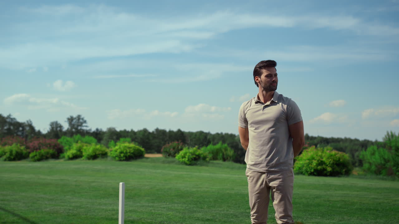 Golf course worker enjoy sunny day. Golfer inspecting player at fairway field.
