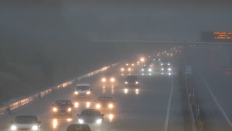 Traffic-during-a-heavy-rainy-day-Montpellier-flooded-highway-lights-on-France