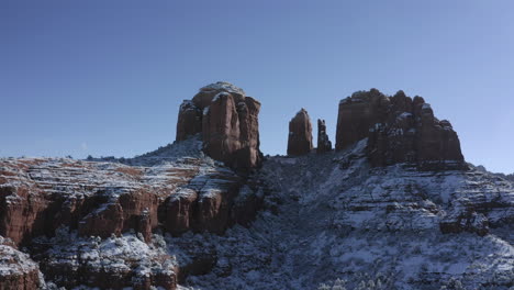 Aerial-Pan-3-of-Cathedral-Rock-near-Oak-Creek,-Sedona-Arizona---After-a-snowfall