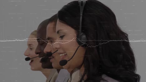 Animation-of-data-processing-over-business-people-using-phone-headsets