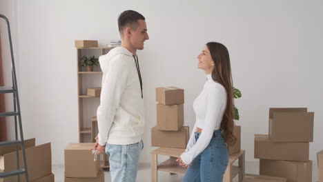 Front-View-Of-Young-Couple-In-A-New-Home