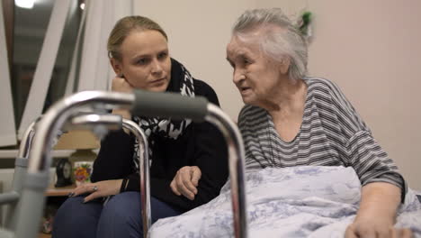 granddaughter coming to see senior grandma in the hospital