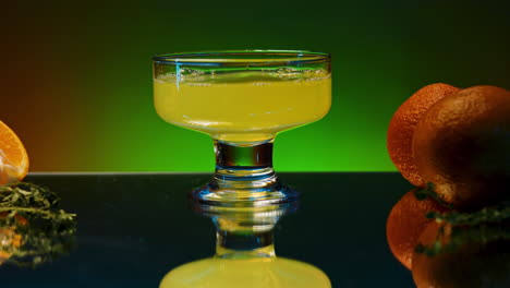 orange juice in glass cup with oranges