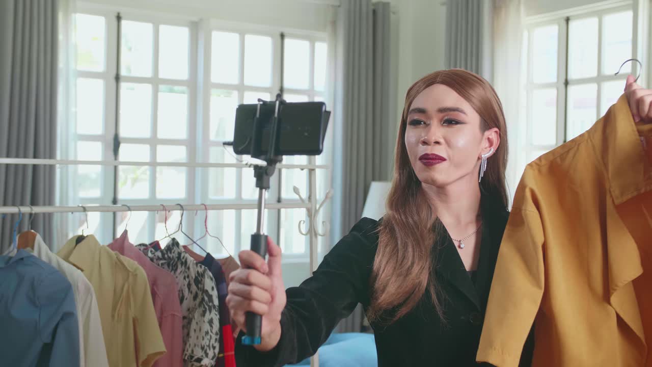 Young Transgender Woman Fashion Blogger Selling Clothes Online By Live Streaming On Mobile Phone, Selfie