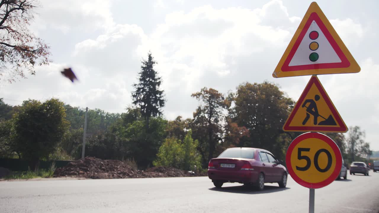VINNYTSIA, UKRAINE - SEPTEMBER 10, 2018: Road signs repairing roads