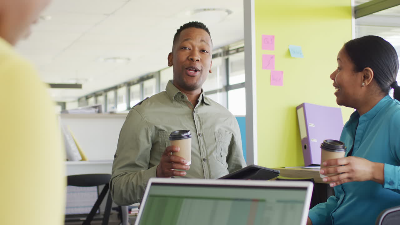 African american business people having meeting at office, slow motion