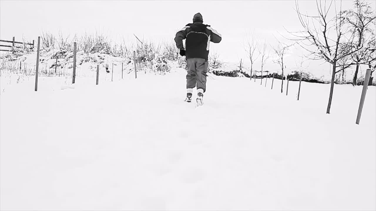 running through snow on a winter's day with people stock footage stock video