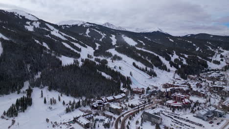 parking lot base half pipe big air jump ski snowboard gondola ski lift aerial drone cinematic copper mountain base colorado winter december christmas ski runs trails landscape circle left