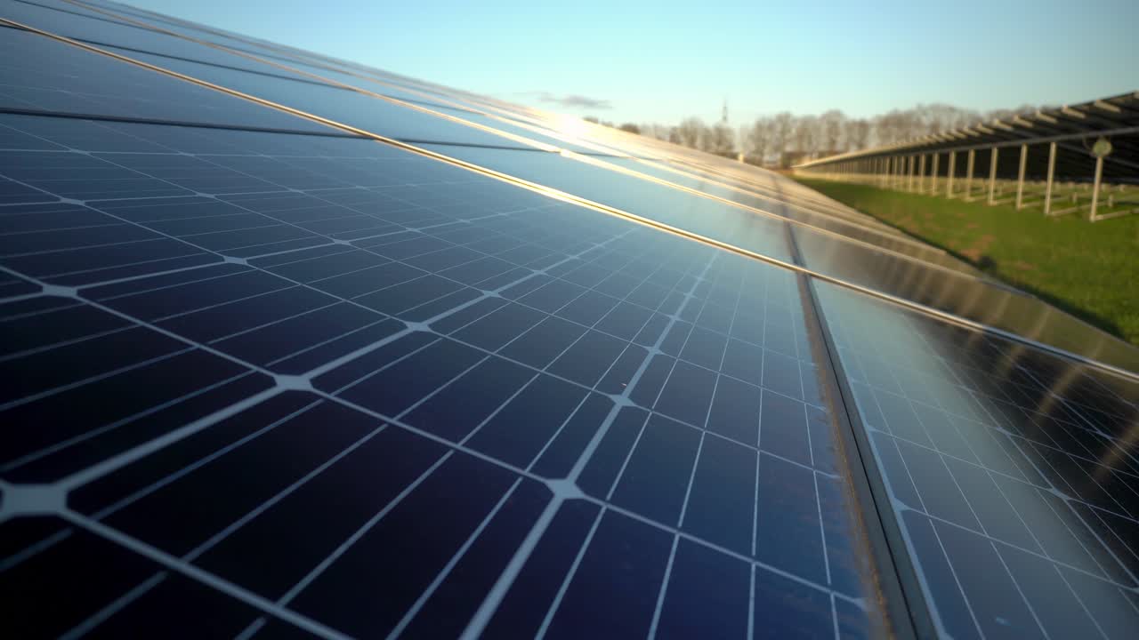 Q cells 300w Monocrystalline silicon solar panels, solar farm sunset, camera tilt