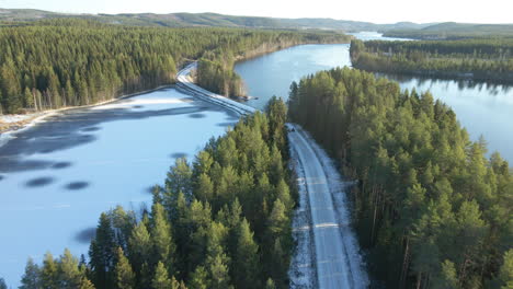 atv driving down a icy road during winter