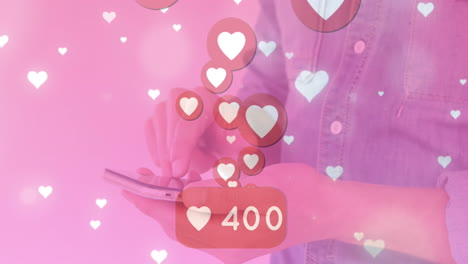 animation of changing numbers in speech bubble over heart icons, midsection of woman using cellphone