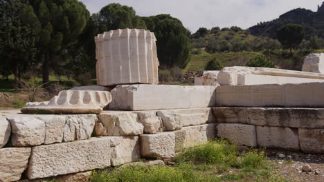 a stone pile and pillar in front of thetemple of artemis in sardis