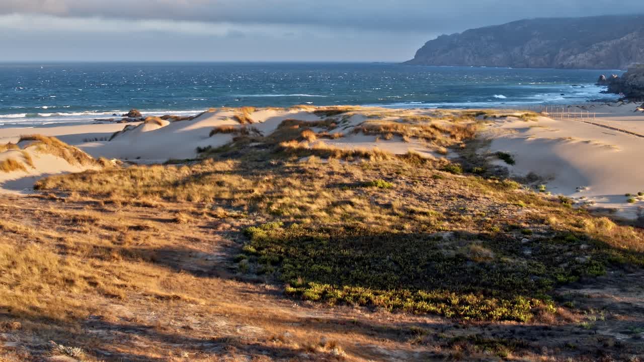 Views of sandy landscape and ocean in Portugal from above