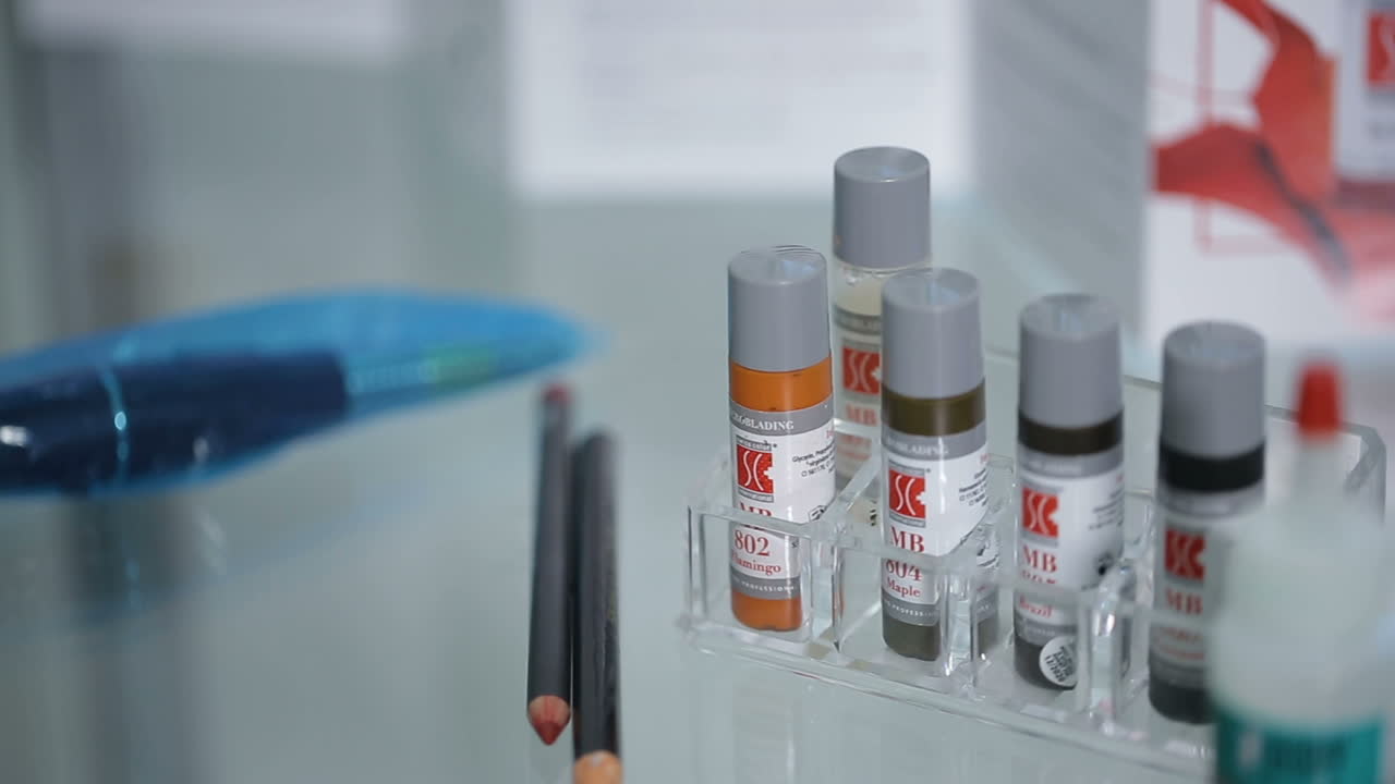 Permanent Makeup Paint. Close up shot of the permanent makeup paint on the table at beaty salon