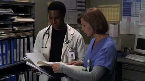 medical professionals reviewing patient files