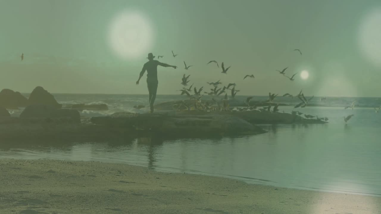 animación de manchas de luz sobre el hombre caucásico en la playa