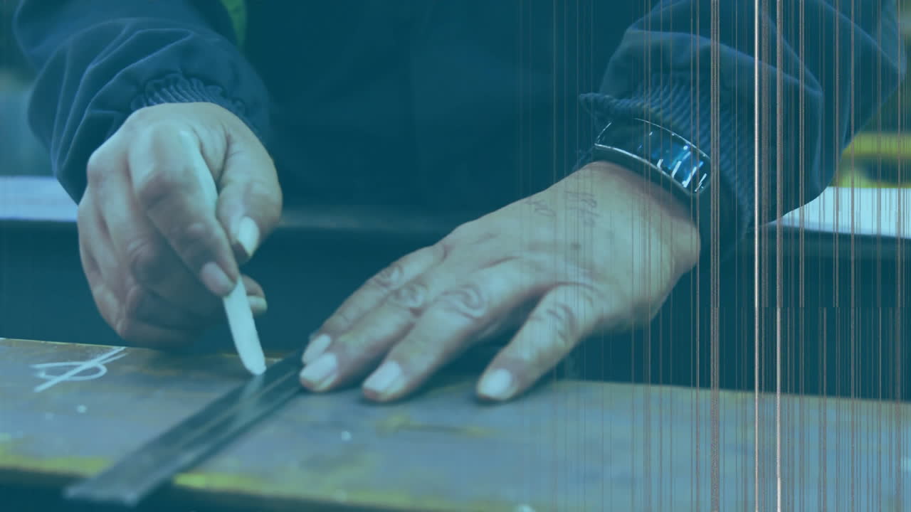 Measuring metal piece with ruler, hand working on workbench in workshop
