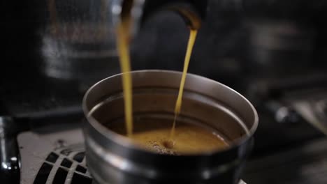 espresso shot: close-up of espresso pouring into cup