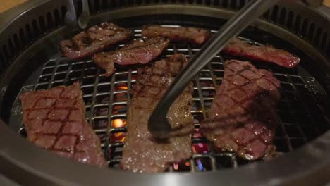 slow motion sizzle – juicy meat grilling over open flame