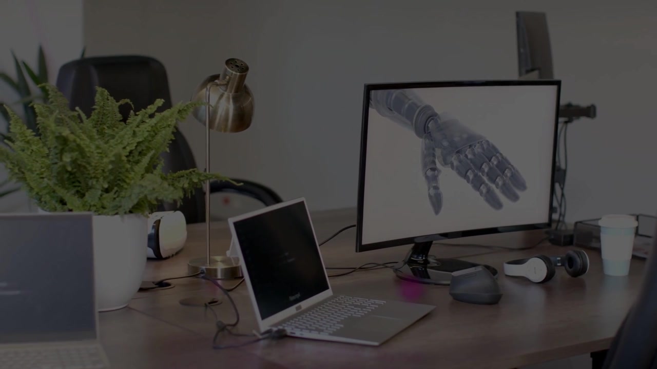 Magenta highlight starting near plant and moving across desk, showing robotic hand for technology