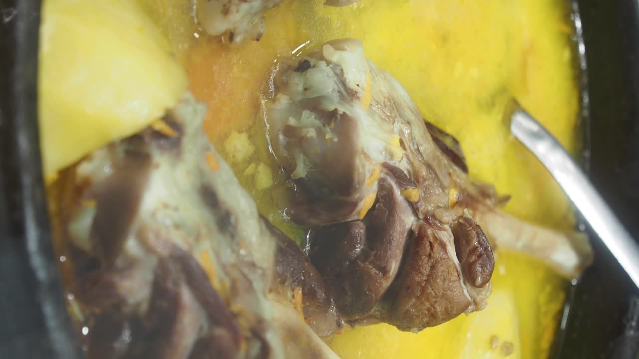 A close-up of a meat soup dish