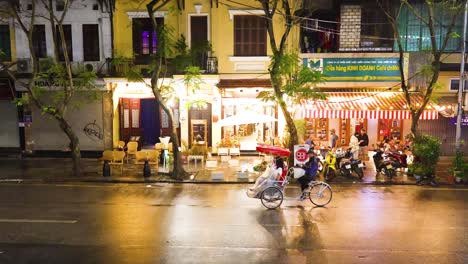 busy street scene outside a hanoi restaurant