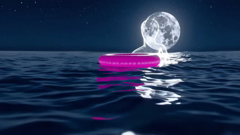 pink inflatable ring floating on water under a glowing moon at night