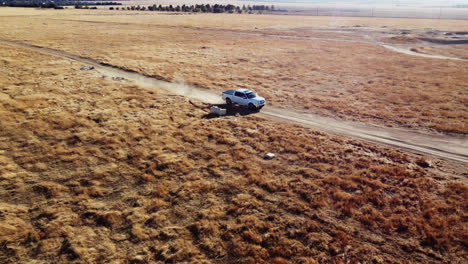 Pickup-Truck-Driving-In-The-Dusty-Dirt-Road-In-California