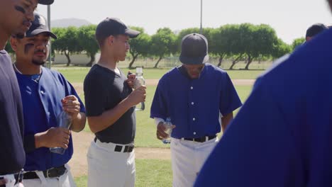 baseball players drinking water