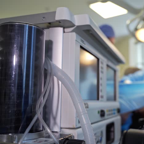 the movement of modern medical device for artificial lung ventilation. ventilator apparatus during the operation. close up. operation at the backdrop in blur