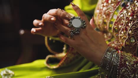 close-up of an asian bride donning her stunning traditional jewelry