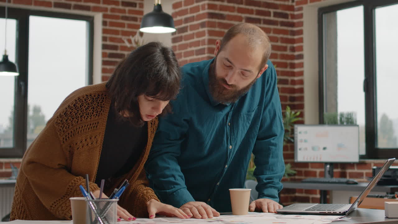 Business Team Collaborating on Data Analysis in Urban Office