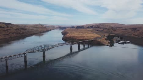 aerial view of a bridge over a river in a canyon