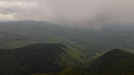 Aerial-4k-view-of-morning-in-Parang-mountain-flying-in-clouds-of-smog