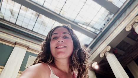 tourist vlogging inside grand hall of athens university