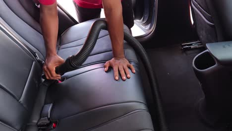 vacuuming a car interior