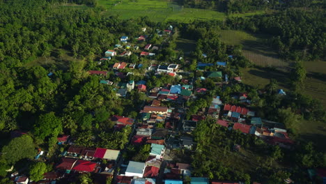 vibrant countryside homes, golden hour in the calabarzon region of luzon, philippines - aerial view