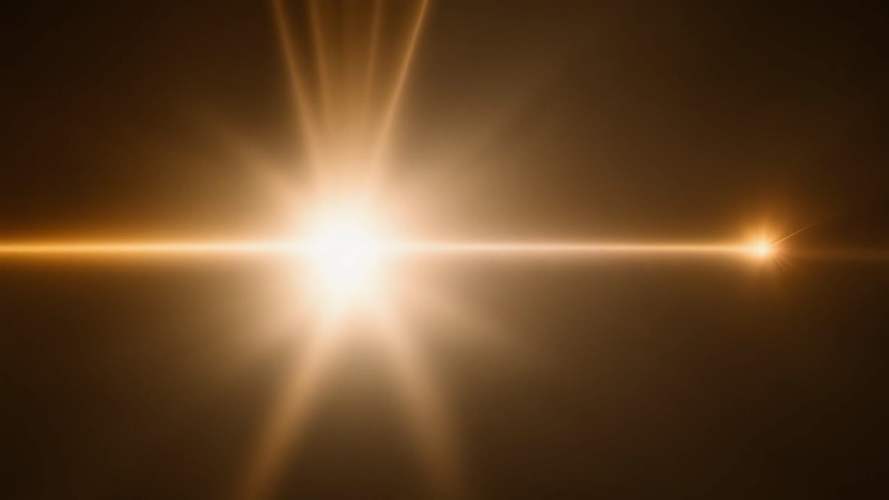Destello de lente dorado brillante moviéndose sobre un fondo oscuro