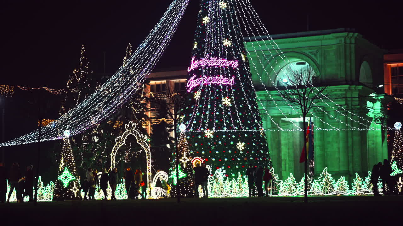 Chisinau, Moldova - December 20, 2021: Enjoy the vibrant holiday light displays in the city square as families and friends gather to celebrate the winter season. Colorful decorations shine bright in the evening