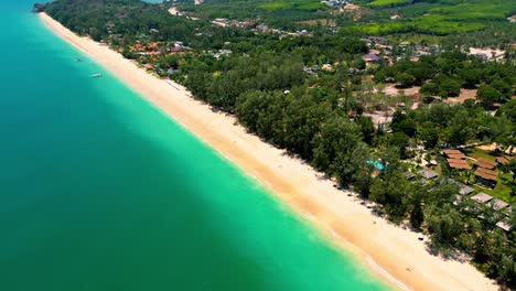 4K-Cinematic-nature-drone-footage-of-a-panoramic-aerial-view-of-the-beautiful-beaches-and-mountains-on-the-island-of-Koh-Lanta-in-Krabi,-South-Thailand,on-a-sunny-day