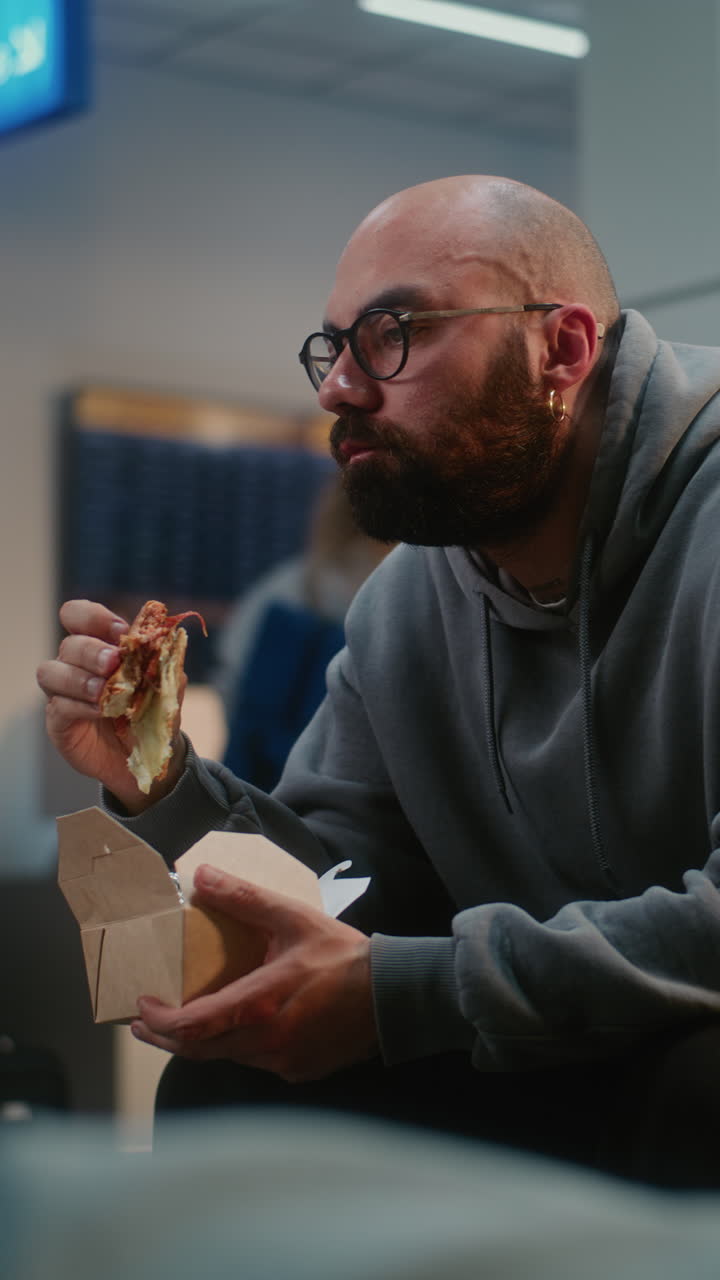 Man Eating Lunch at the Airport