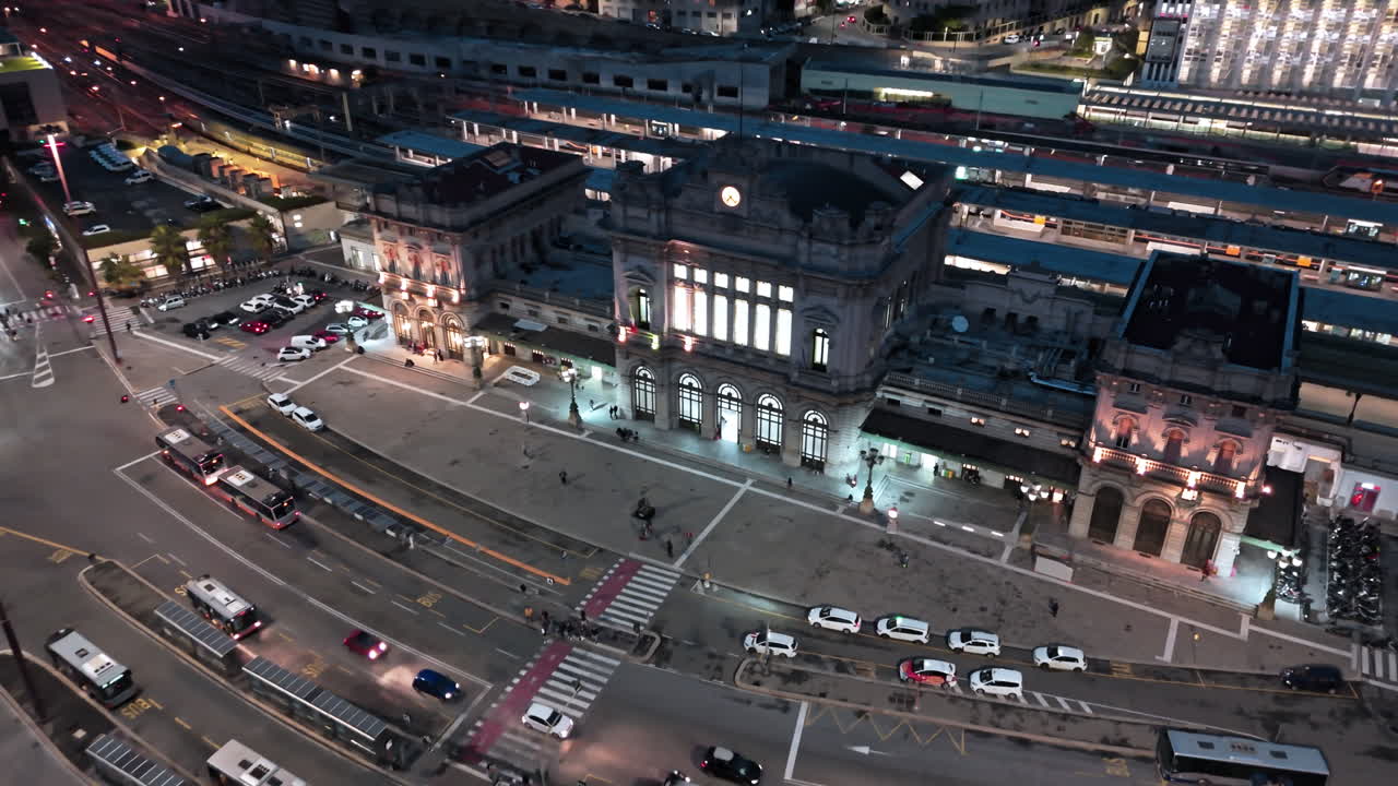 Exterior of Brignole railway station with traffic on street, Genoa. Aerial