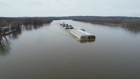 a towboat pushes barges north on the mississippi river-4