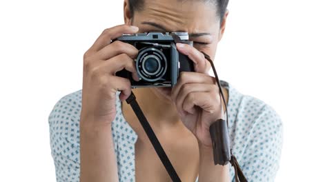 Animation-of-caucasian-woman-holding-camera-over-white-background