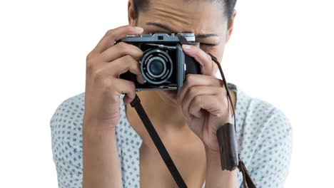 animation of caucasian woman holding camera over white background